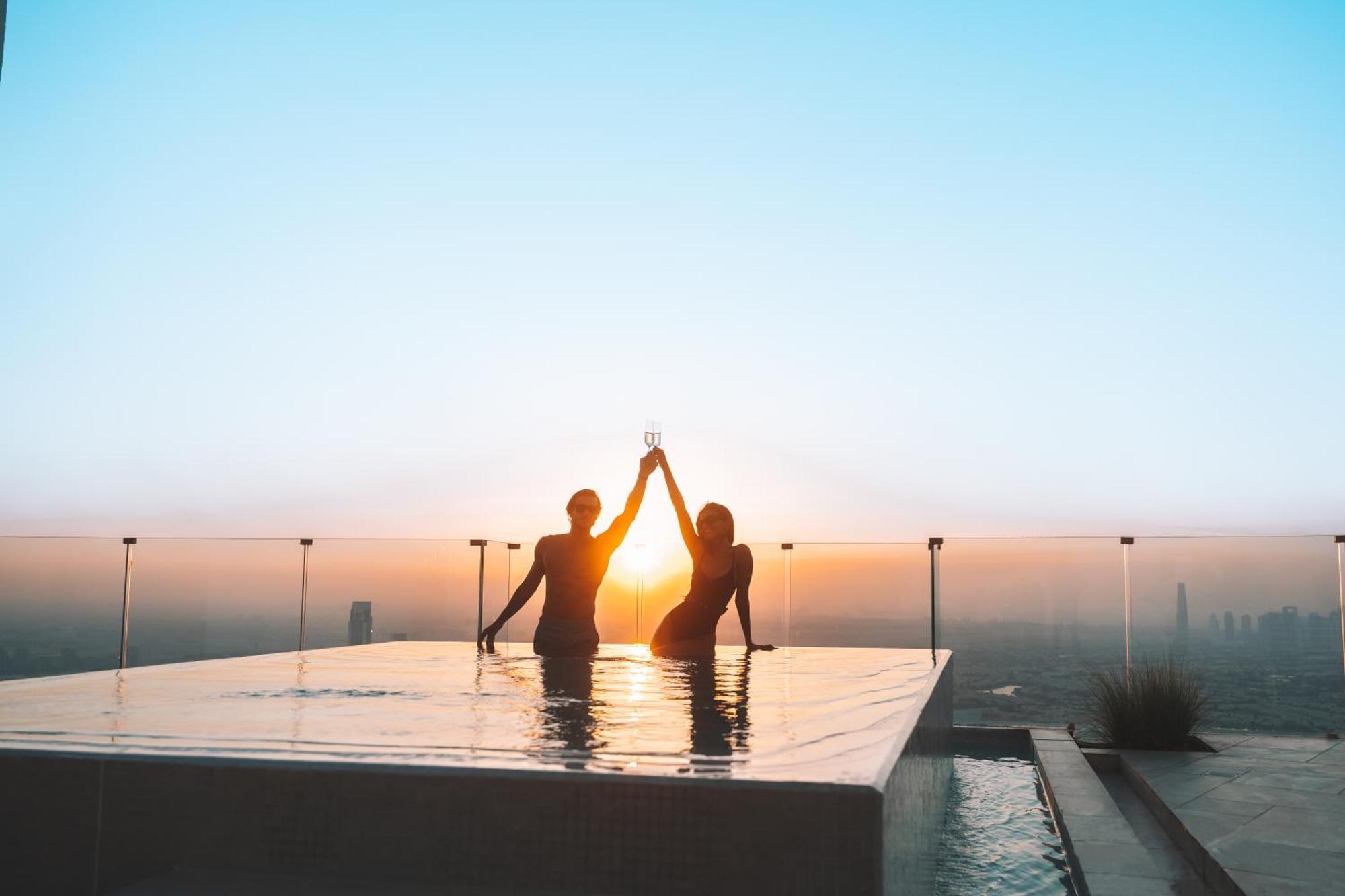Five Jumeirah Village Dubai Buitenkant foto Sunset at the rooftop pool