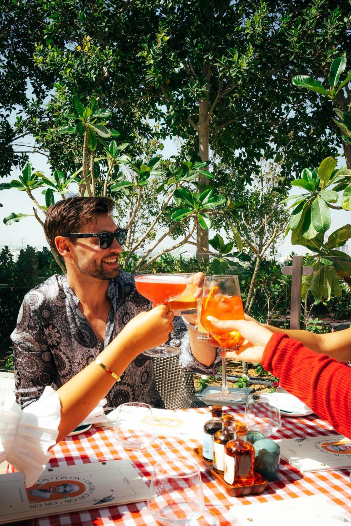 Five Jumeirah Village Dubai Buitenkant foto A man drinking a spritz